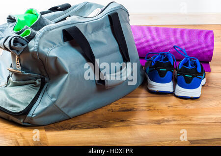 Sport bag on the wooden floor Stock Photo