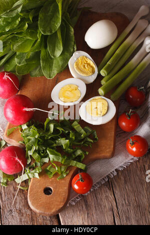 Ingredients for spring salad closeup. vertical top view Stock Photo