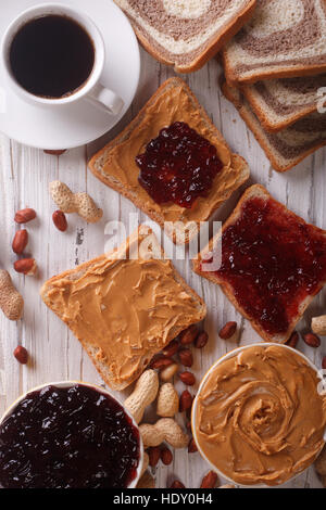 https://l450v.alamy.com/450v/hdy0h4/sweet-sandwiches-with-jam-peanut-butter-and-coffee-close-up-on-the-hdy0h4.jpg