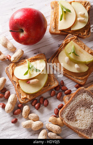 sandwiches with peanut butter and an apple. vertical view from above Stock Photo