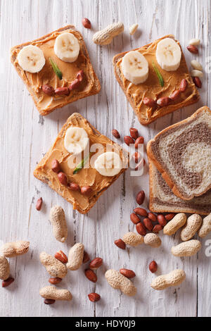 Funny sandwiches for children with peanut butter. vertical top view Stock Photo