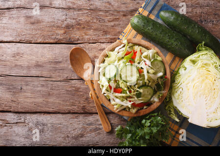 Homemade food: cabbage salad and ingredients on the table, view from above Stock Photo