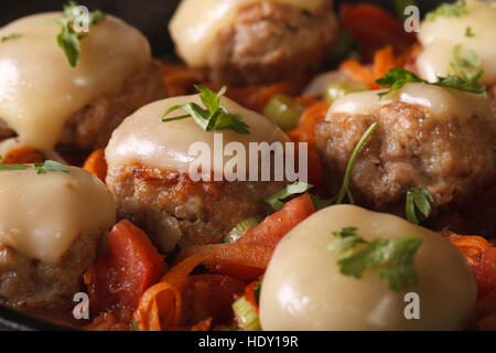 Meatballs baked with mozzarella and vegetables close-up. horizontal Stock Photo