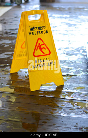 Caution wet floor yellow sign Stock Photo