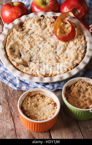 Traditional apple crisp close-up in baking dish. Vertical, rustic style Stock Photo