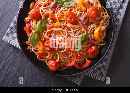 Italian food: pasta with minced meat and vegetables close-up. Horizontal top view Stock Photo