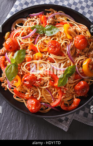 Italian food: pasta with minced meat and vegetables close-up. vertical top view Stock Photo
