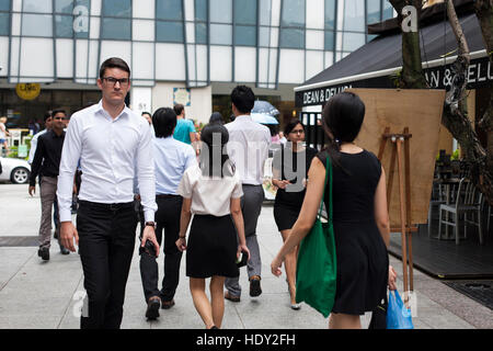 Group Of Businesspeople Crossing Street Stock Photo