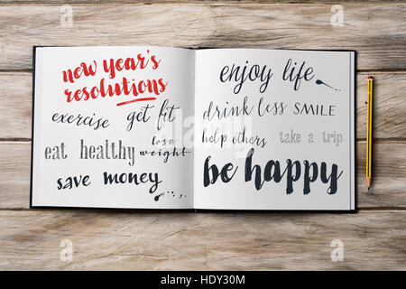high-angle shot of a pencil and a notebook with some new years resolutions written in it, such as exercise, get fit, eat healthy, save money, smile, e Stock Photo