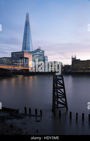 London's Shard photographed at sunset from the northside of the  river Thames and showing London Bridge Stock Photo