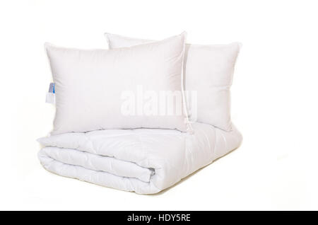 Rolled white duvet cover on white isolated background Stock Photo