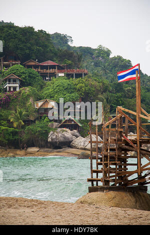 Flag on the beach in Ko Pha Ngan in Thailand Stock Photo