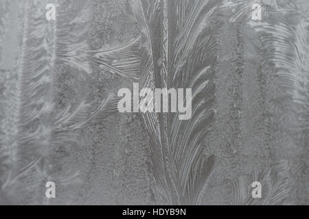 Frosty patterns on glass. Winter Christmas mood. Texture, Stock Photo
