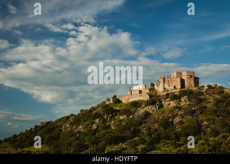 Beautiful Spanish old castle over a hill with a amazing sky of background Stock Photo