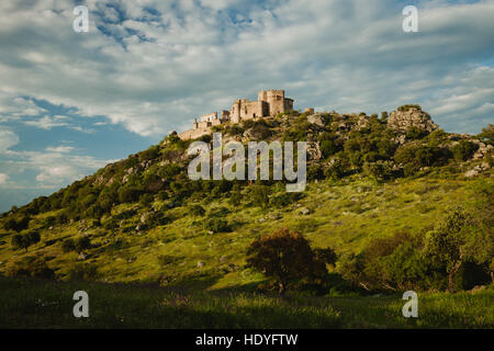 Beautiful Spanish old castle over a hill with a amazing sky of background Stock Photo