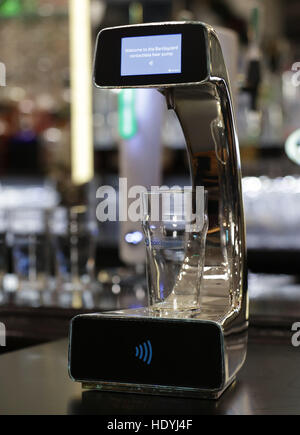 Embargoed to 0001 Friday December 16 General view of the world's first contactless, self-serving beer pump, which has been developed by Barclaycard to help cut bar queues on nights out, at Henry's Cafe and Bar in Piccadilly, London. Stock Photo