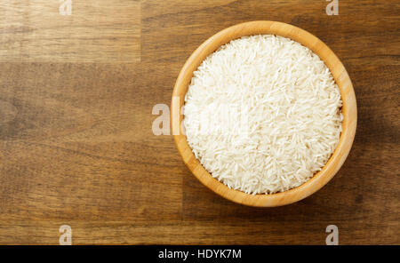 White rice in a wooden bowl Stock Photo