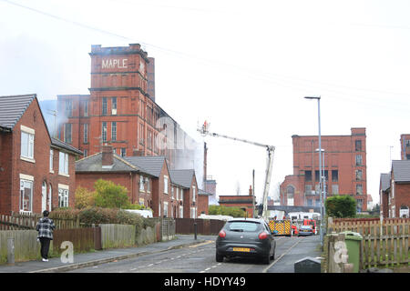 Oldham, UK. 15th Dec, 2016. Fire fighters tackle a blaze close to a residential area of Oldham, 15th December, 2016  Credit:  Barbara Cook/Alamy Live News Stock Photo