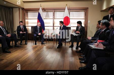 Nagato, Japan. 15th Dec, 2016. Russian President Vladimir Putin during a bilateral meeting with Japanese Prime Minister Shinzo Abe December 15, 2016 in Nagato, Yamaguchi, Japan. The two are meeting at a hot spring resort to resolve issues over security and economic ties. © Planetpix/Alamy Live News Stock Photo