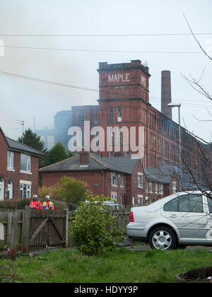 Oldham Lancashire, UK. 15th Dec, 2016. Huge fire was attended by the Greater Manchester Fire Services in Oldham Lancashire, at one stage the flames were roaring above the building. The whole surrounding area was cordoned off as the fire fighters battled with the blaze. Credit:  jozef mikietyn/Alamy Live News Stock Photo