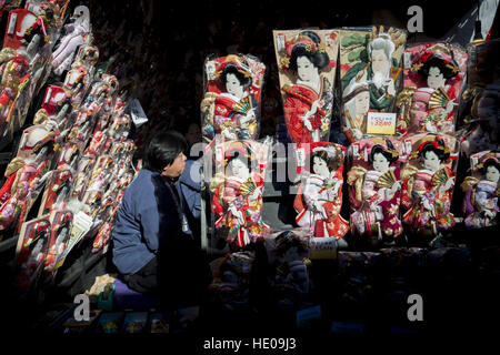 Tokyo, Tokyo, Japan. 17th Dec, 2016. Decorated battledores, shuttlecocks and kites are on sale at open-air stalls during an annual fair held on the grounds of Sensoji Buddhist Temple in Tokyos downtown Asakusa in Tokyo. The fair originated in the 16th century from a custom to give a battledore and pray for the healthy growth of girls, symbolizing the racket as a ''board to bounce back evil. © Alessandro Di Ciommo/ZUMA Wire/Alamy Live News Stock Photo