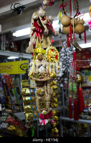 Items hanging in an esoteric shop in La Paz, Bolivia including garlic, gourds, all intended to improve your luck Stock Photo