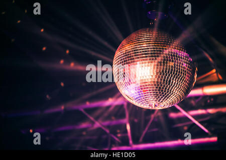 Disco ball with bright rays, night party background photo Stock Photo