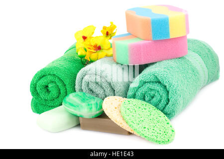 Spa set with towels, soaps, sponges and orchid flowers isolated on white background. Stock Photo
