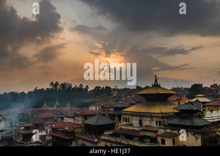 Sunset over the buildings of Pashupatinath temple, at the banks of Bagmati River Stock Photo