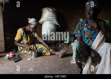 Life inside the Kukuo Witch Camp located in the Namumba South District of Northern Ghana, one of the only witch camps in the world. There are currently hundreds of alleged 'witches' living in the five camps across northern Ghana and although Ghanaians are extremely superstitious, these camps are not a story of witch craft or unusual activity, they are the story of lack of women's rights and discrimination against widowers who become a burden to their family. Despite fierce social stigmatism, being exiled from their communities and having most of their basic human rights violated, the women acc Stock Photo