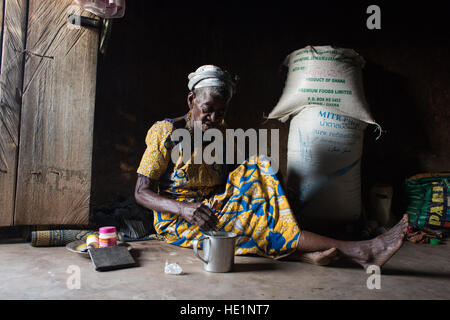 Life inside the Kukuo Witch Camp located in the Namumba South District of Northern Ghana, one of the only witch camps in the world. There are currently hundreds of alleged 'witches' living in the five camps across northern Ghana and although Ghanaians are extremely superstitious, these camps are not a story of witch craft or unusual activity, they are the story of lack of women's rights and discrimination against widowers who become a burden to their family. Despite fierce social stigmatism, being exiled from their communities and having most of their basic human rights violated, the women acc Stock Photo