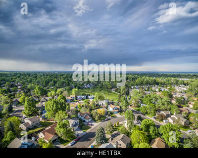 FORT COLLINS, CO, USA - MAY 23, 2016: Storm cloud over city of Fort Collins in northern Colorado - aerial view of springtime scenery.