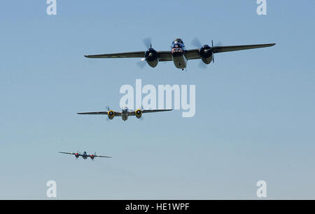 Vintage B-25 Mitchell bombers fly over the National Museum of the U.S. Air Force at Wright-Patterson Air Force Base, Ohio, during a memorial flight honoring the Doolittle Tokyo Raiders on April 18, 2010.  The 68th Doolittle Raiders’ reunion commemorates the anniversary of the Doolittle Tokyo Raid.  On April 18, 1942, U.S. Army Air Forces Lt. Col. Jimmy Doolittle’s squad of 16 B-25 Mitchell aircraft bombed Japanese targets in response to the attack on Pearl Harbor. /Tech. Sgt. Jacob N. Bailey Stock Photo