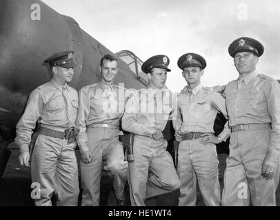 Photograph taken 17 December 1941. Nine Japanese planes were shot down by these five young Army Air Force officers during the Japanese attack. Left to right they are-2nd Lt. Harry W. Brown, who bagged one Japanese plane; 2nd Lt. Philip M. Rasmmussen, one plane; 2nd Lt. Kenneth M. Taylor, two planes; 2nd Lt. George S. Welch, four planes; 1st Lt. Lewis M. Sanders, one plane. Lts. Welch and Taylor received Distinguished Service Crosses. Stock Photo