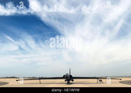 A U.S. Air Force aircraft maintainer assigned to the 9th Reconnaissance Wing, attaches wheels to the wings of a U-2S Dragon Lady aircraft as the pilot of the plane taxis to the hanger after returning from a routine sortie at Beale Air Force Base, California, June 14, 2016. Both sets of wheels beneath the wings of the U-2S are used for stabilization when the plane takes off and taxis. As the aircraft lifts into the air on take off, both sets of wheels detach from the aircraft and are gathered by Airmen who reattach them when the aircraft lands.  Staff Sgt. Kenny Holston Stock Photo