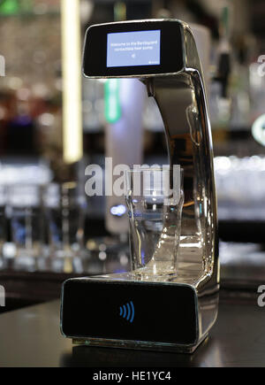 General view of the world's first contactless, self-serving beer pump, which has been developed by Barclaycard to help cut bar queues on nights out, at Henry's Cafe and Bar in Piccadilly, London. Stock Photo