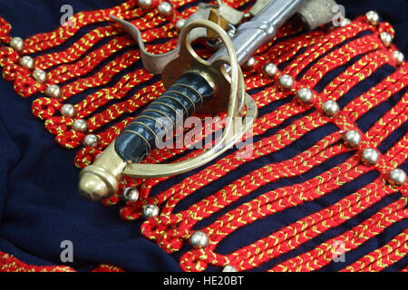 Closeup of elegance antique sword lying on old Russian military uniform Stock Photo