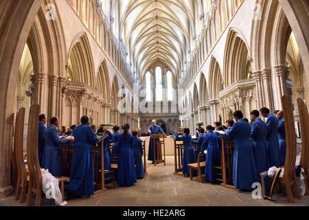 Great Choir  from Wells Cathedral Choir on Easter Day and rehearsing for evensong in the nave at Wells Cathedral. Stock Photo