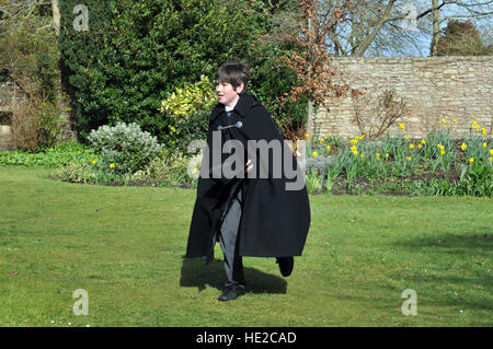 Choristers from Wells Cathedral Choir taking part in Easter egg hunt after the end of Easter chorister duties. Stock Photo