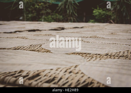 Rice paper drying on straw mats in Vietnam Stock Photo