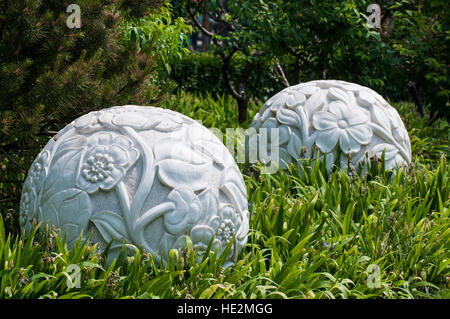 Local carved sculptured sculpted stone balls spheres artwork sculptures in park Beijing, China. Stock Photo