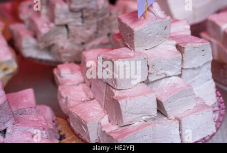 Freshly made marshmallows for sale on a plate. Stock Photo
