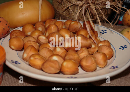 Italian Cheese Smoked Scamorza in White Dish Stock Photo