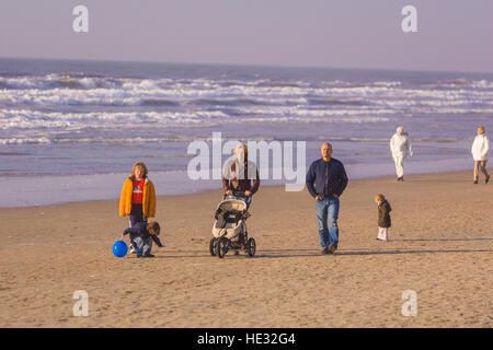 NOORDWIJK, NETHERLANDS - People walk on beach at resort town on the North Sea coast. Stock Photo