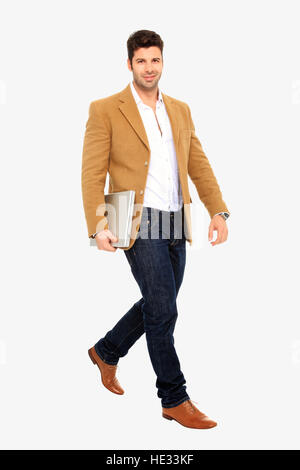 young handsome man holding a laptop isolated on a white background Stock Photo