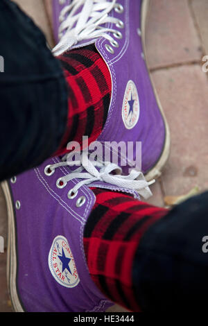 The purple One Star Converse Chuck Taylor high tops worn by the infamous photographer Steve Skjold. St Paul Minnesota MN USA Stock Photo