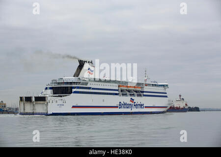 Brittany Ferries Cap Finistere arriving in Portsmouth harbour on a gray winters day. Moving left to right going away stern shot. Stock Photo