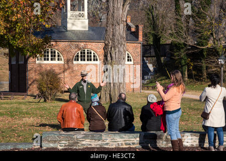 Harpers Ferry, WV - A park ranger talks with visitors at Harpers Ferry National Historical Park. Stock Photo