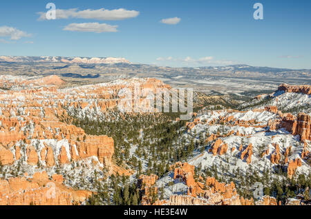Hoodoos, canyon walls, fins, trees, and snow at a view point from Inspiration Point in Bryce Canyon National Park. Stock Photo