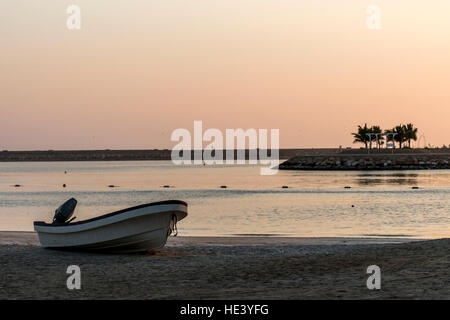 Boat on the beach in salalah oman at sunrise time 2 Stock Photo